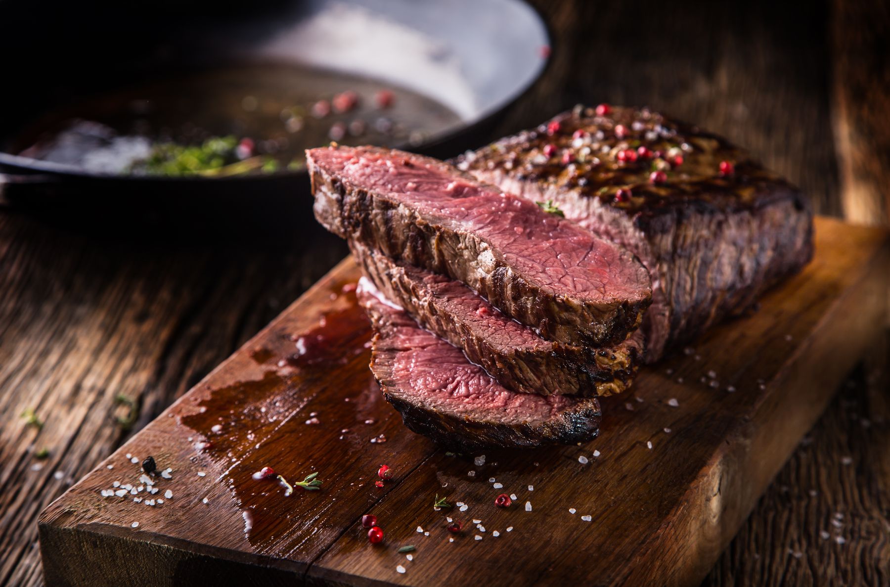 Steaks displayed on a cutting board